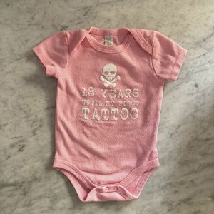 Pink onesie - 18 years til my first tattoo